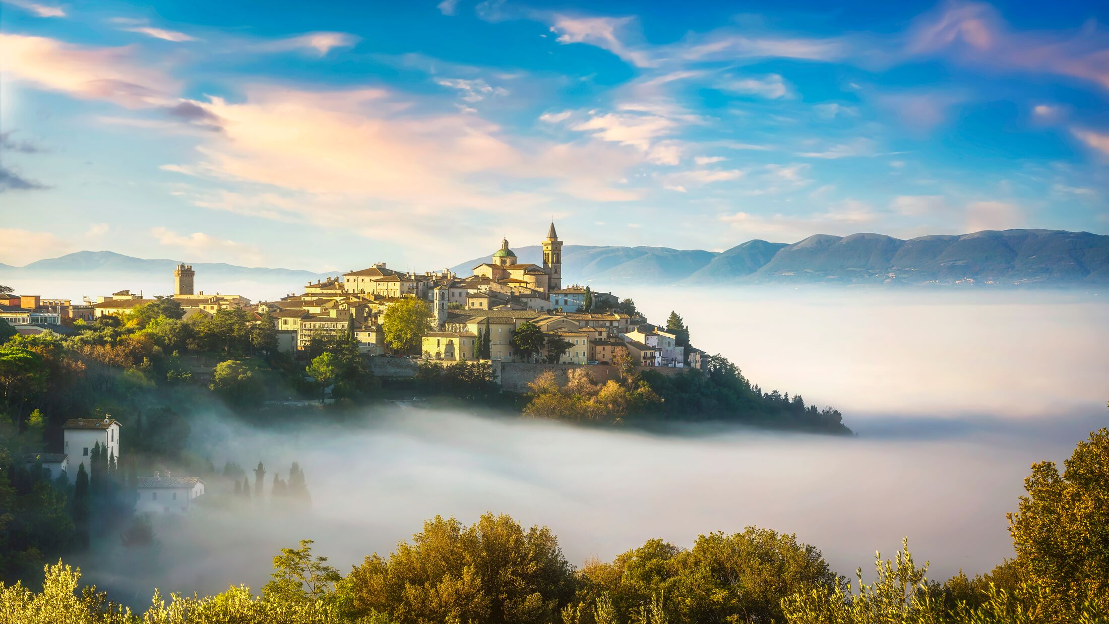 Trevi picturesque village in a foggy morning. Perugia, Umbria, Italy, Europe.