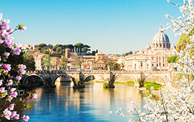 St. Peter's cathedral over bridge and river in Rome at spring day, Italy
