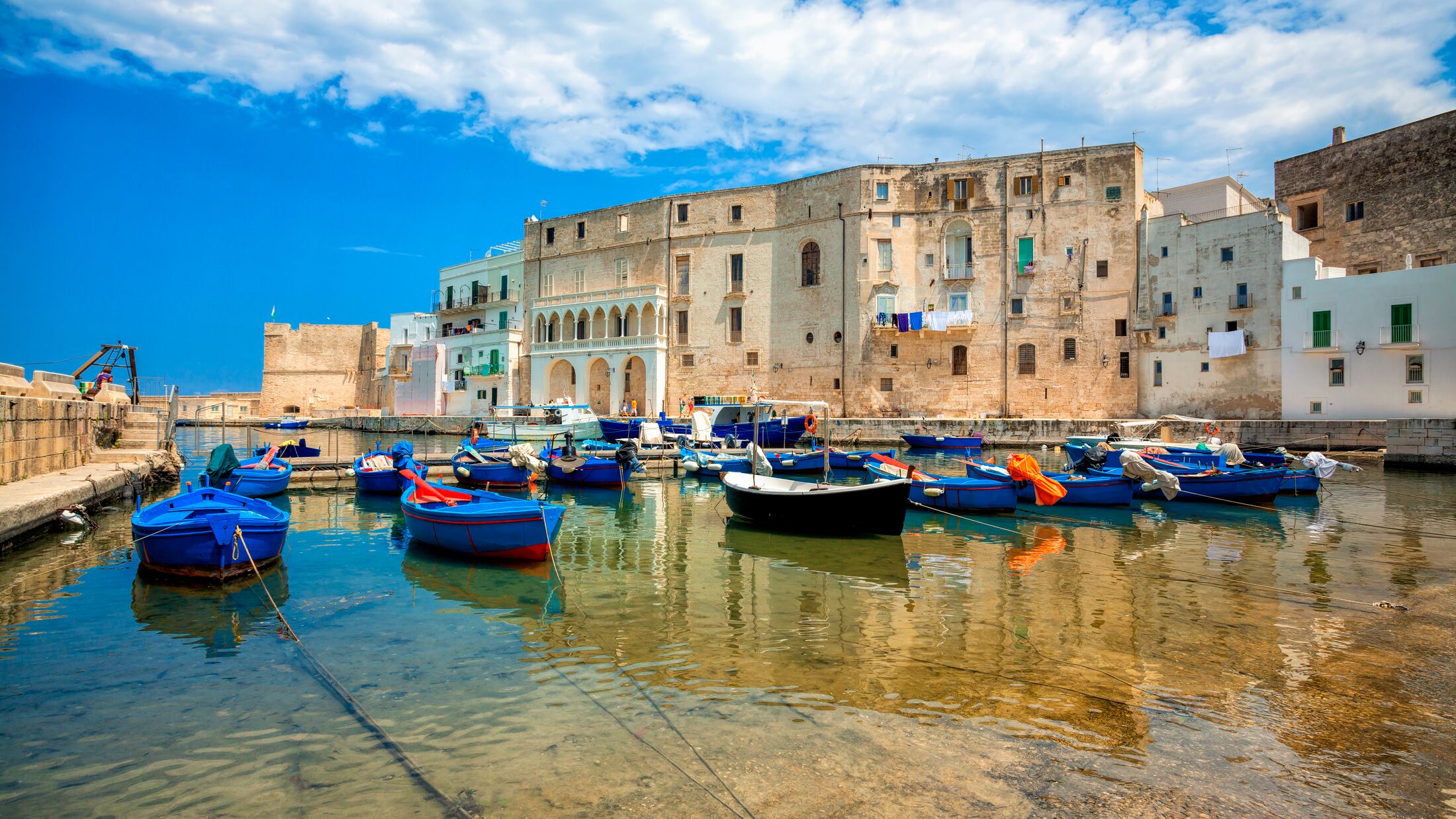 Old port of Monopoli province of Bari, region of Apulia, southern Italy. Boats in the marina of Monopoli.