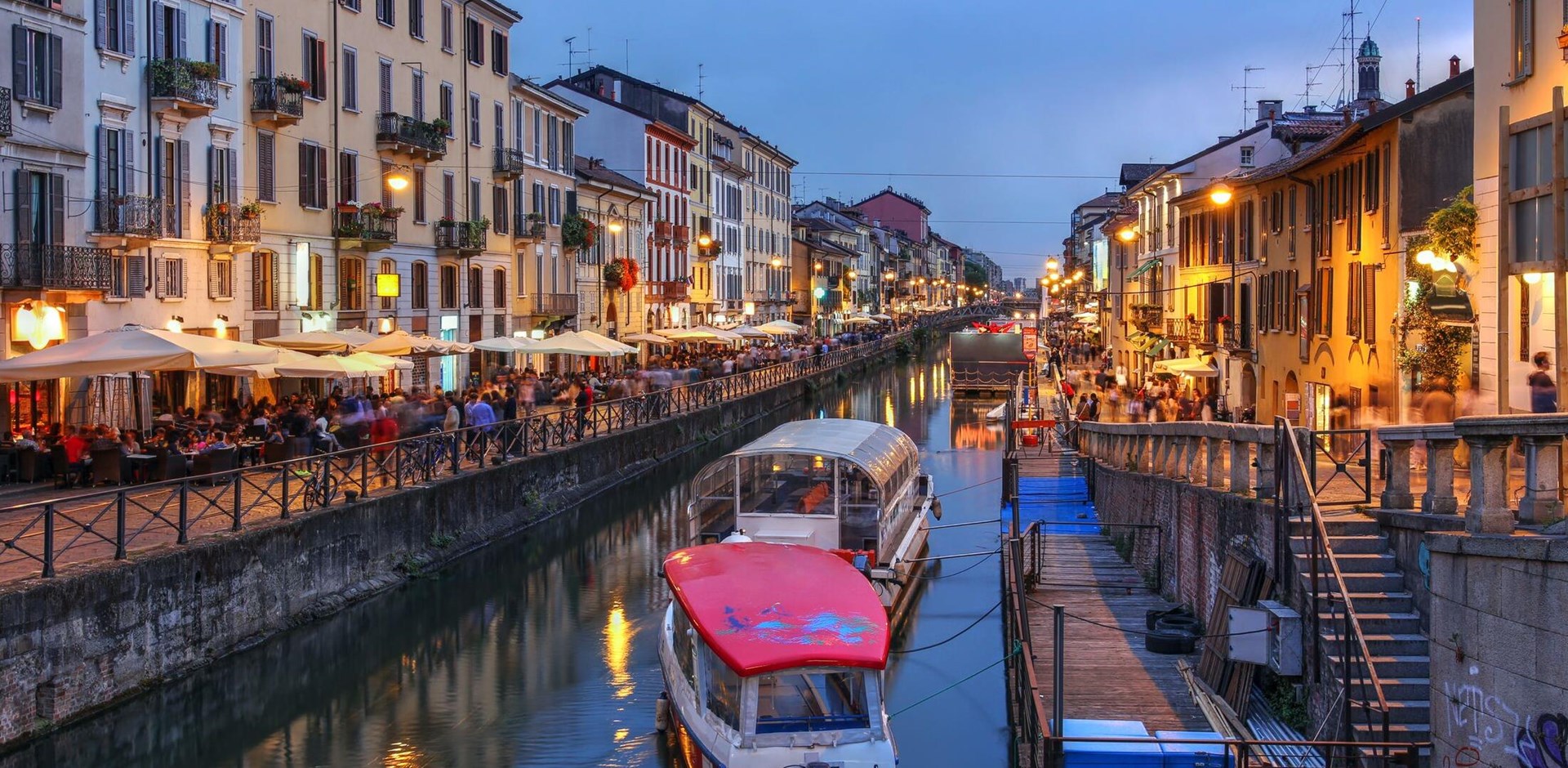 Evening scene along the Naviglio Grande canal in Milan, Italy.