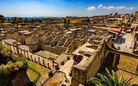 Italy. Ruins of Herculaneum (UNESCO World Heritage Site) - general view. There are the Palestra in the foreground and Decumanus Maximus in the right