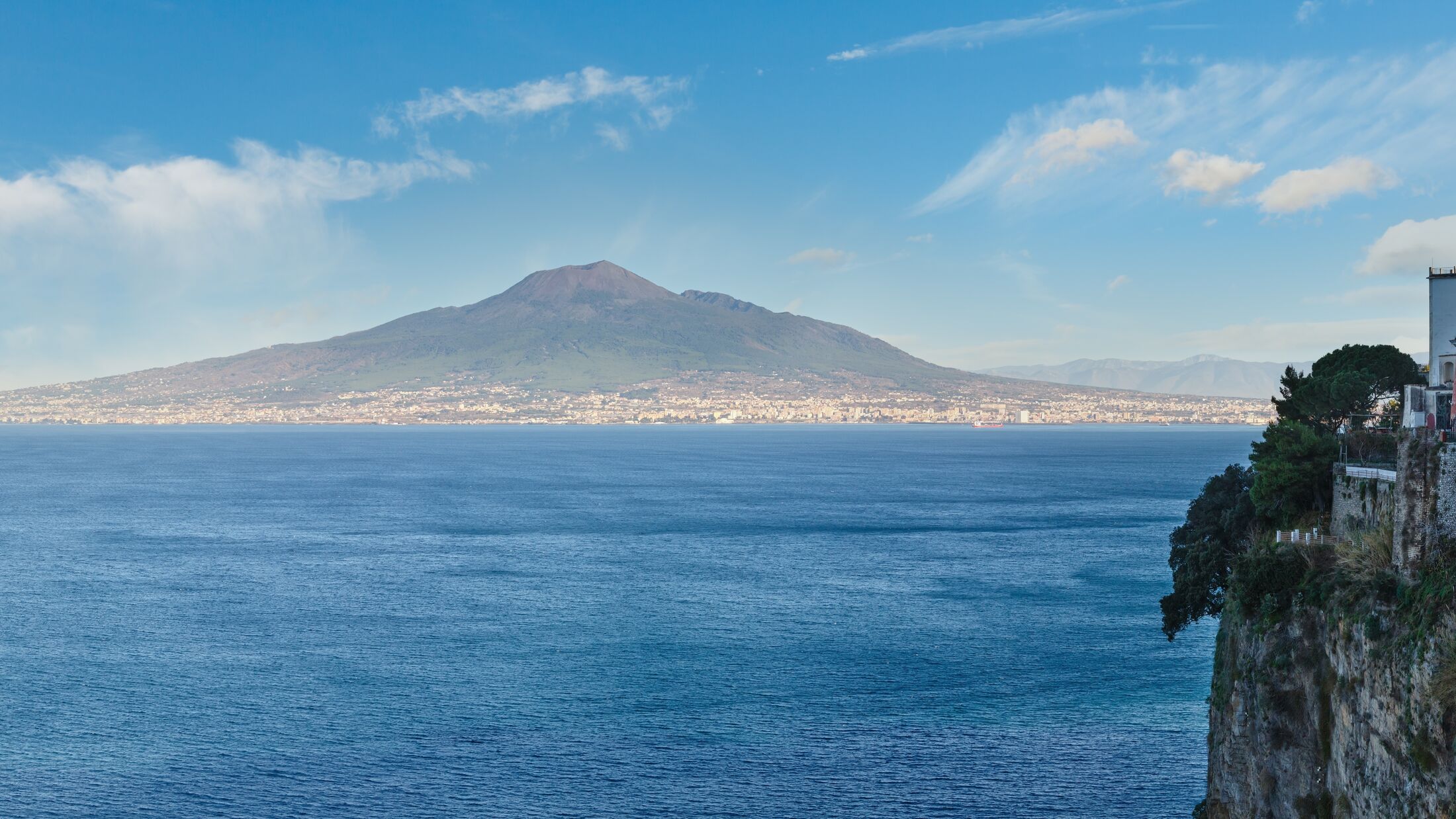 View from Sorrento town on Naples coast and Mount Vesuvius. Sea coastline panorama (Italy).
