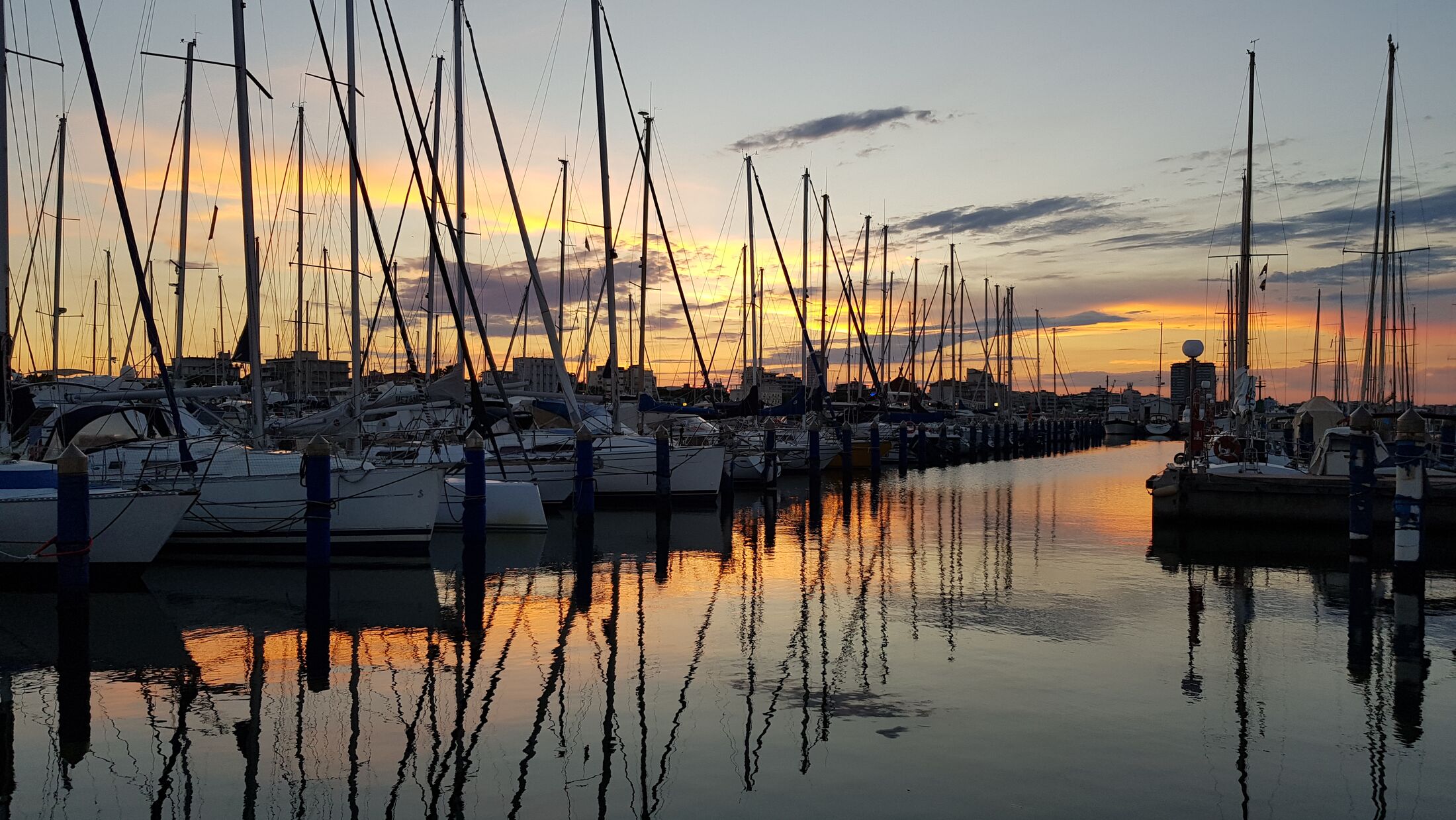 Cervia Milano Marittima Commercial sea port at sunset with boats