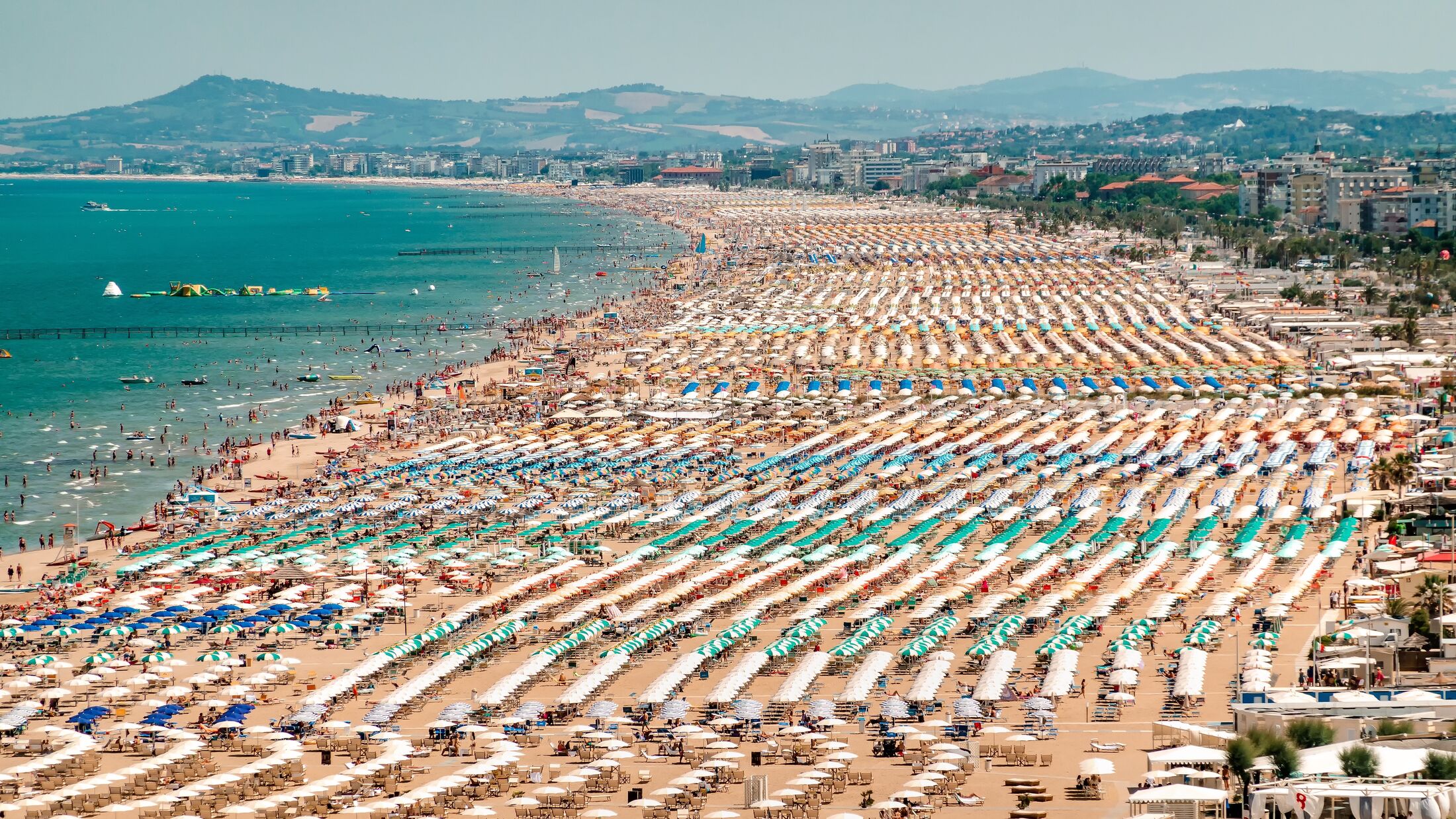 Rimini, Italy - A beach full of people in Rimini, Italy is a popular beach resort on the Adriatic coast in the Italian region of Emilia-Romagna.
