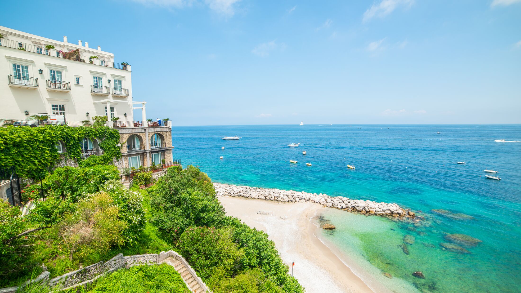 a large body of water with buildings in the background