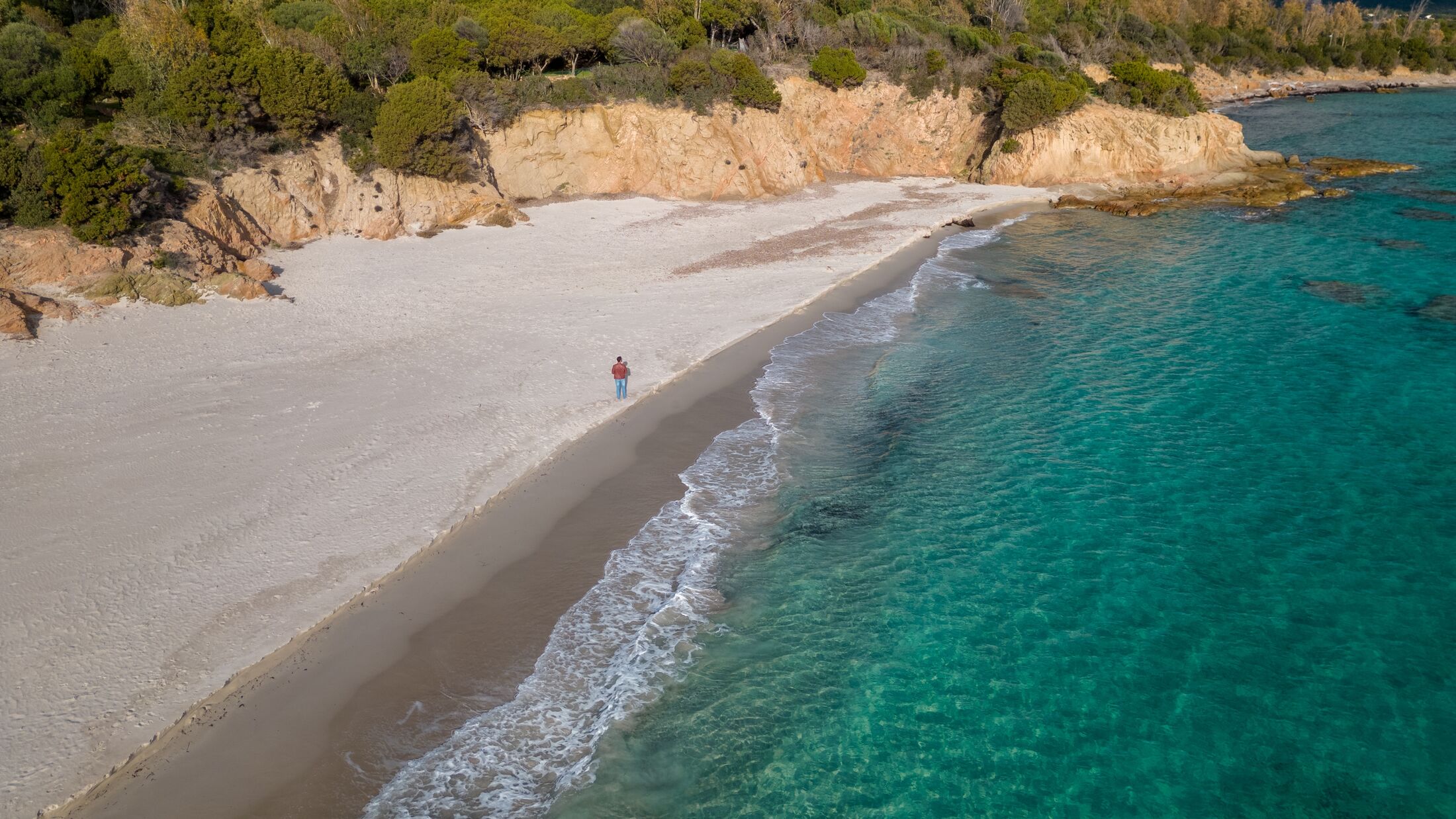 Aerial drone shots of the port of Teulada with Isola Rossa and Tramatzu beach with white sand and crystal clear water.