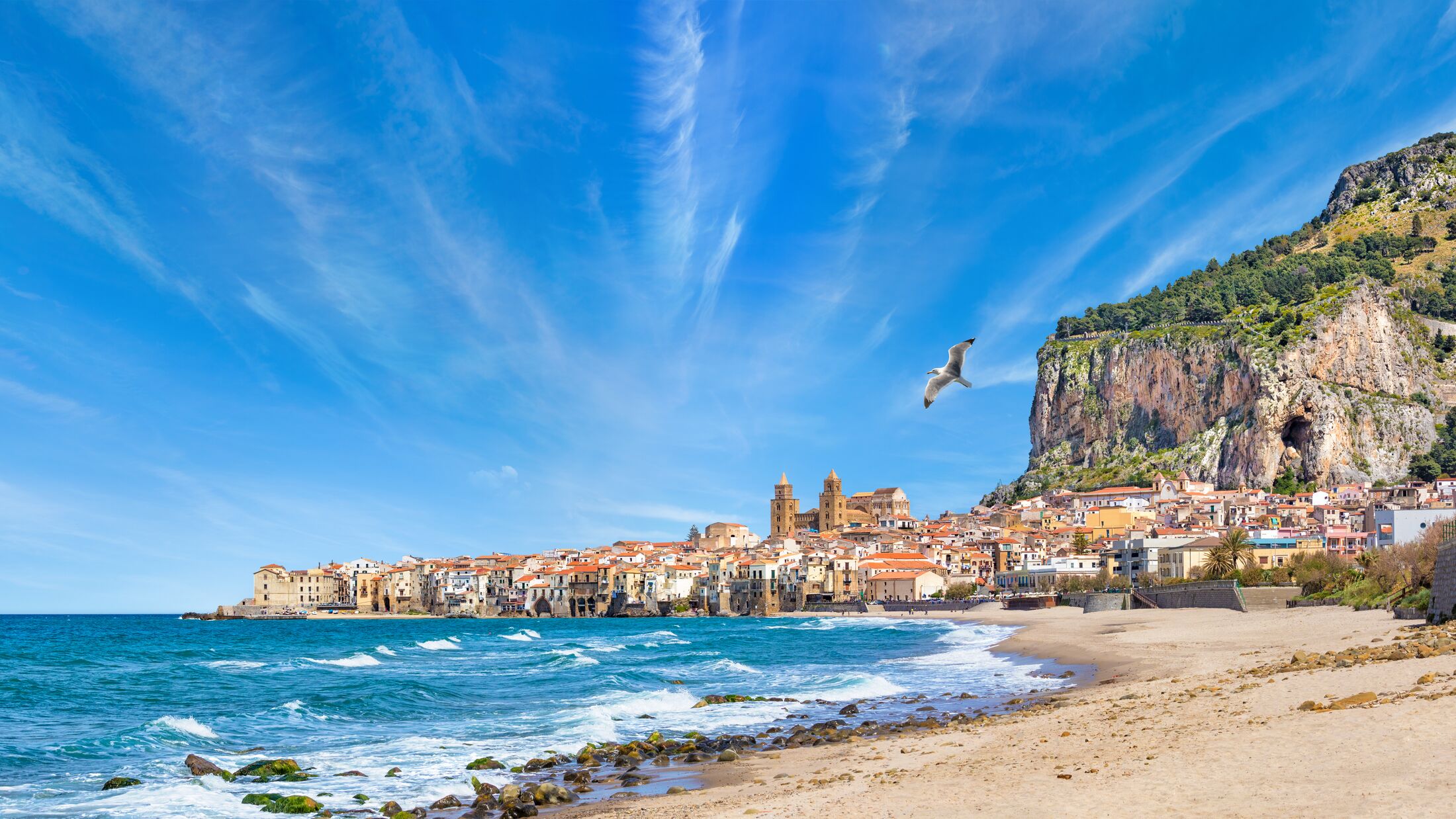 Panoramic view of Cefalu, town in Italian Metropolitan City of Palermo located on Tyrrhenian coast of Sicily, Italy. Cefalu is popular travel destination in Europe because of long beach and clear sea.