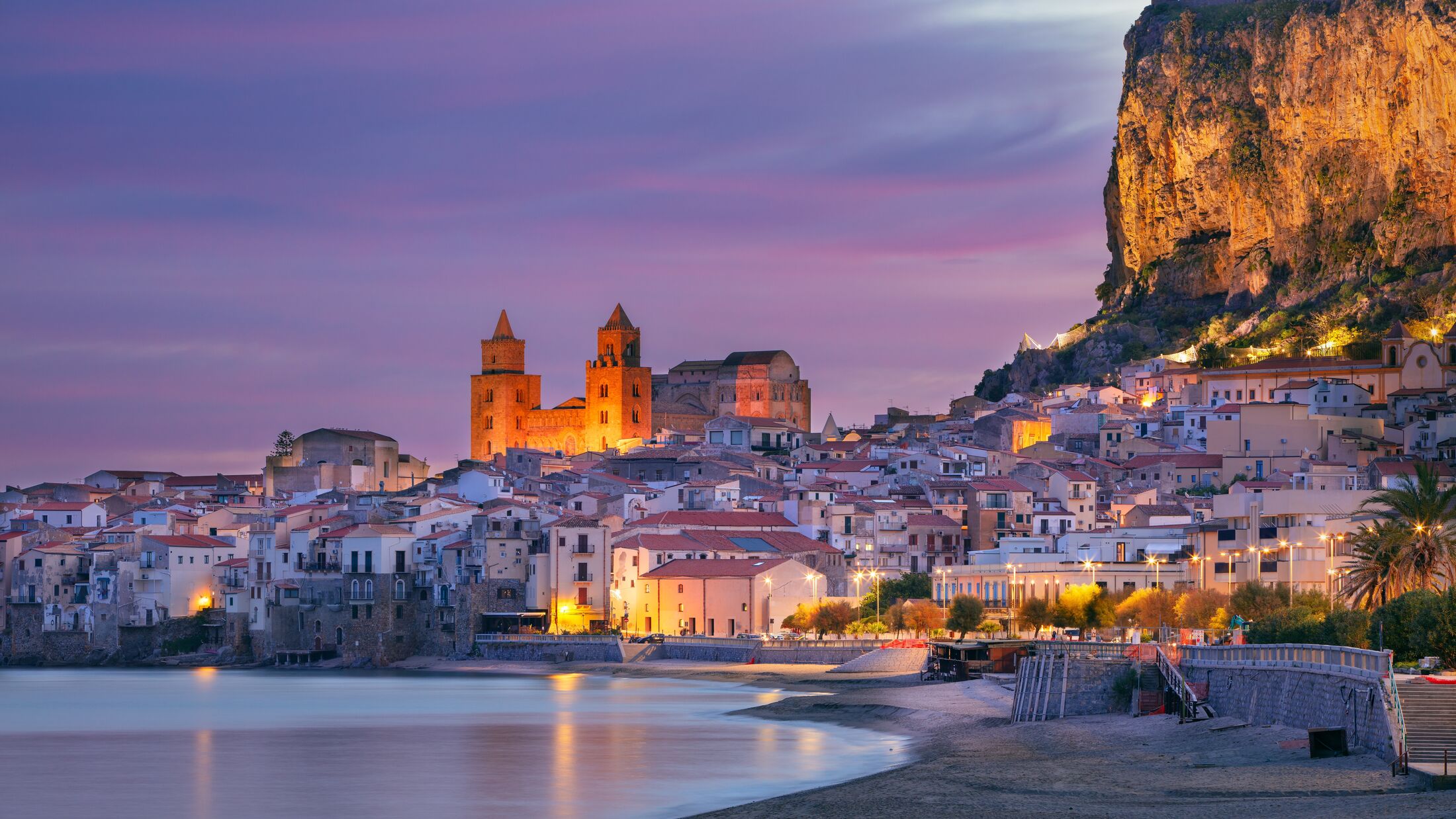 Cefalu, Sicily, Italy. Cityscape image if coastal town Cefalu in Sicily at dramatic sunrise.