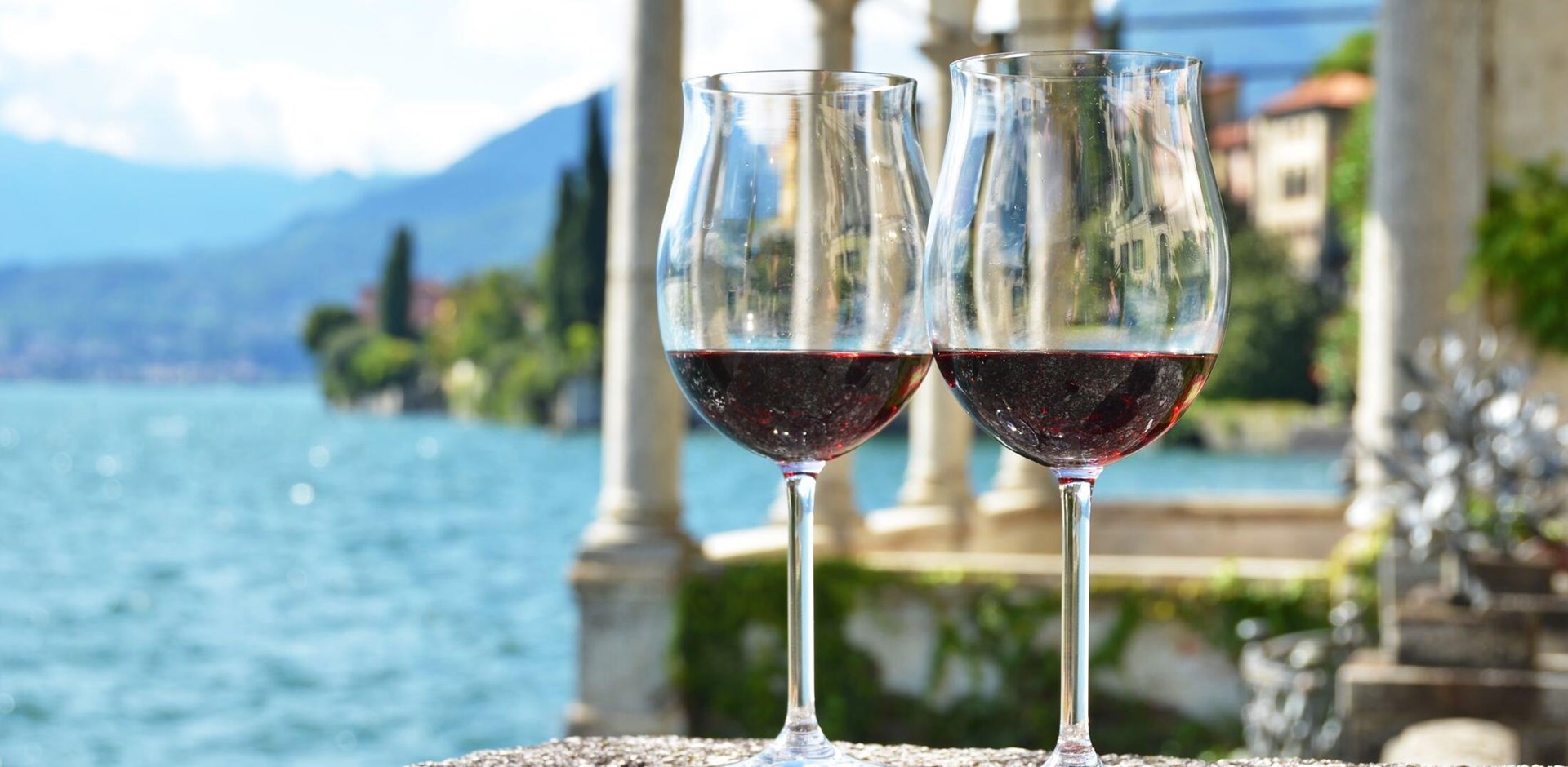 Two wineglasses. Varenna town at the lake Como, Italy