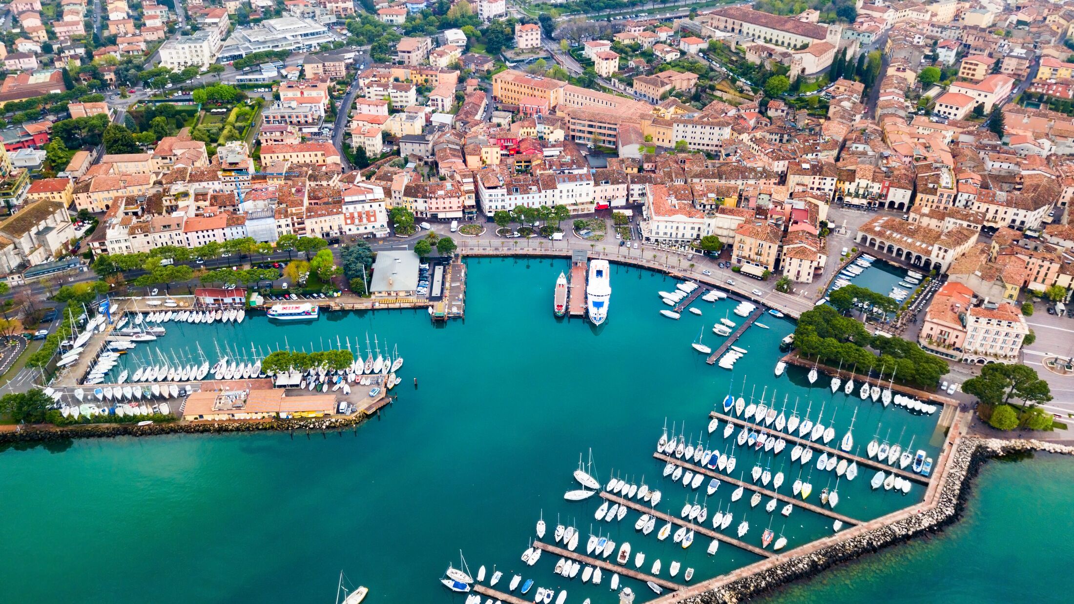 Desenzano del Garda harbor aerial panoramic view. Desenzano is a town on the shore of Lake Garda in the Brescia province in Lombardy, Italy.