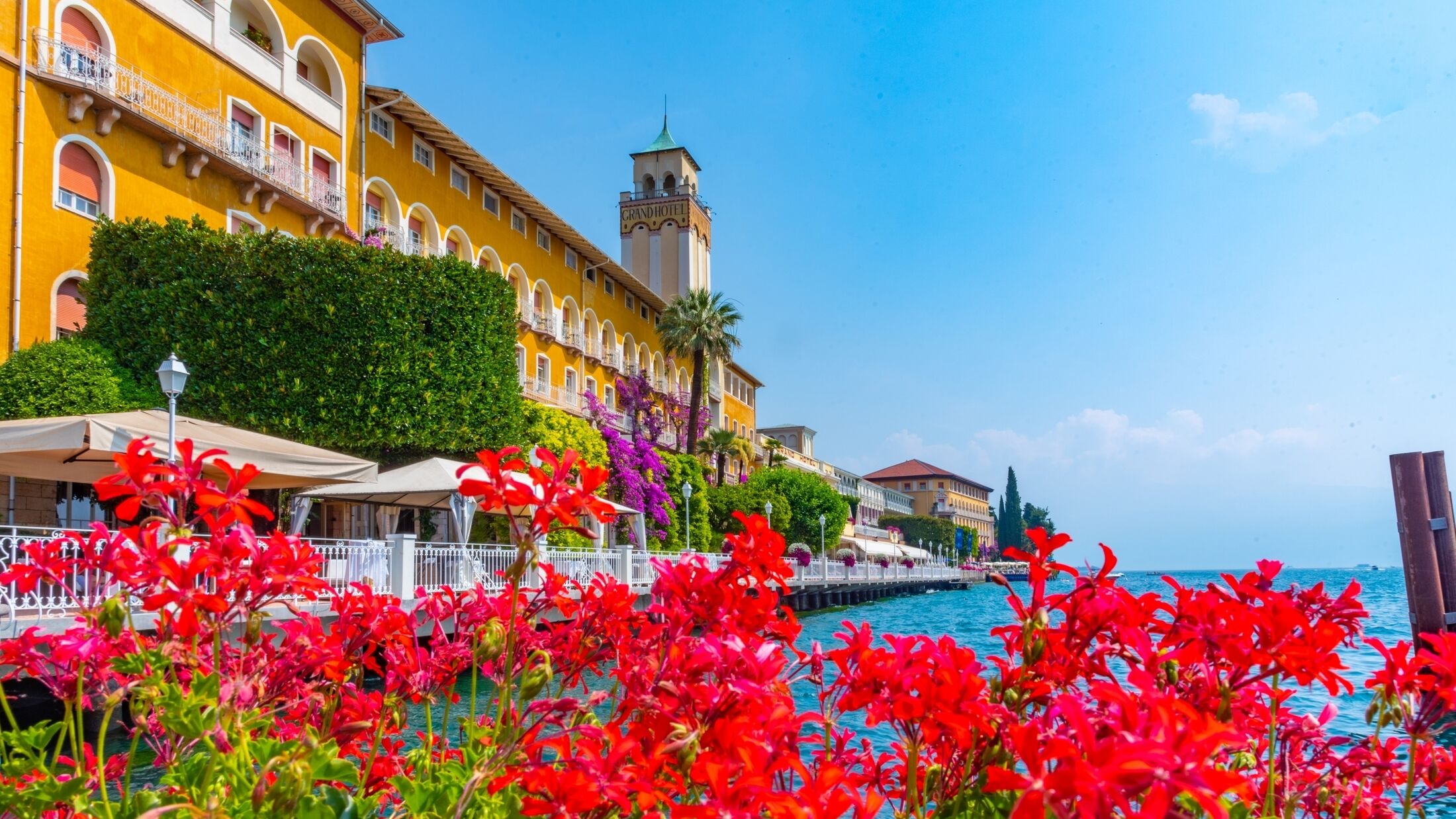 Gardone riviera viewed behined flowers, Italy