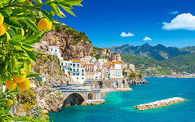 Beautiful view of Amalfi on the Mediterranean coast with lemons in the foreground, Italy
