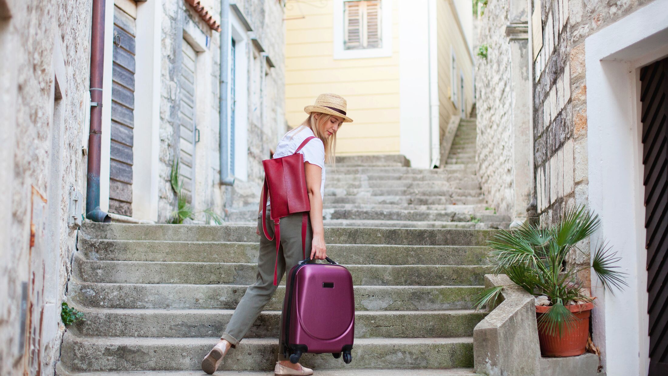 Woman with Luggage on the stairs