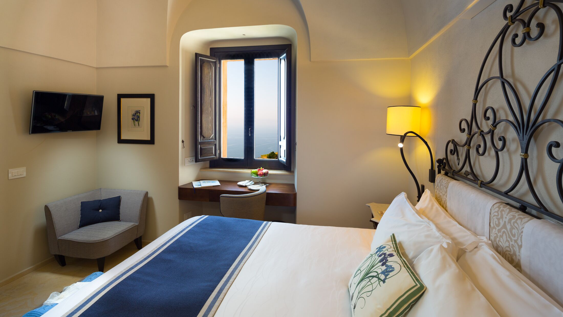 a bedroom with a bed and a mirror