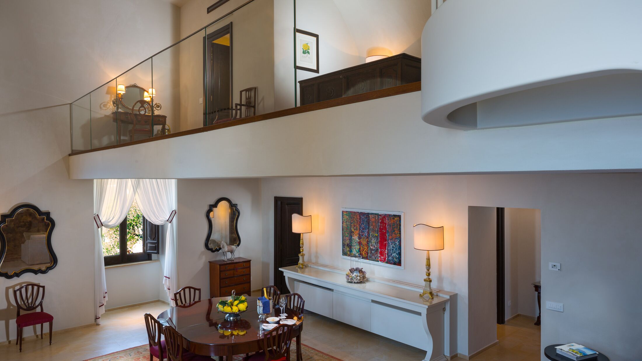 a view of a living room filled with furniture and a fireplace