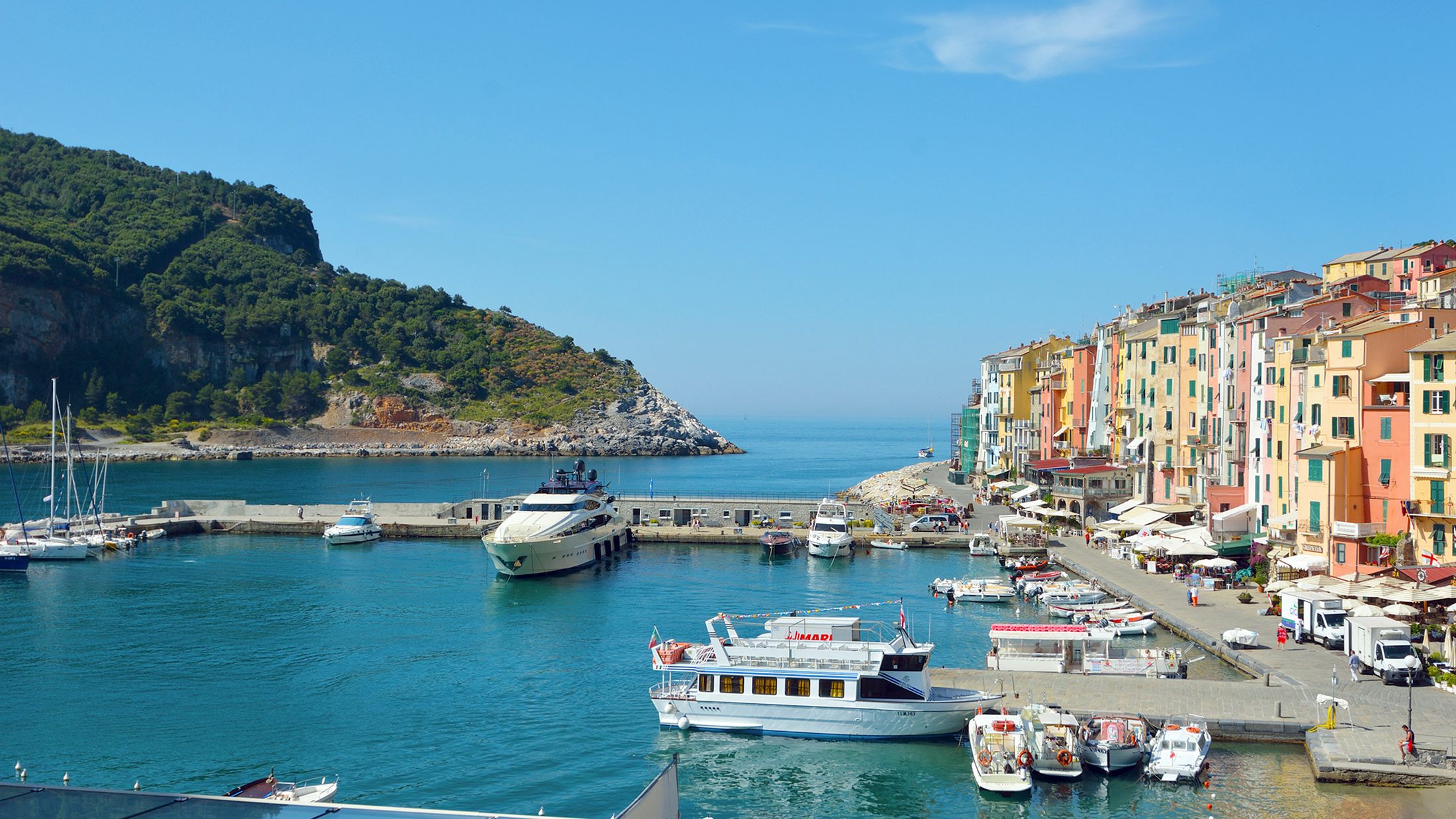 a boat is docked next to a body of water