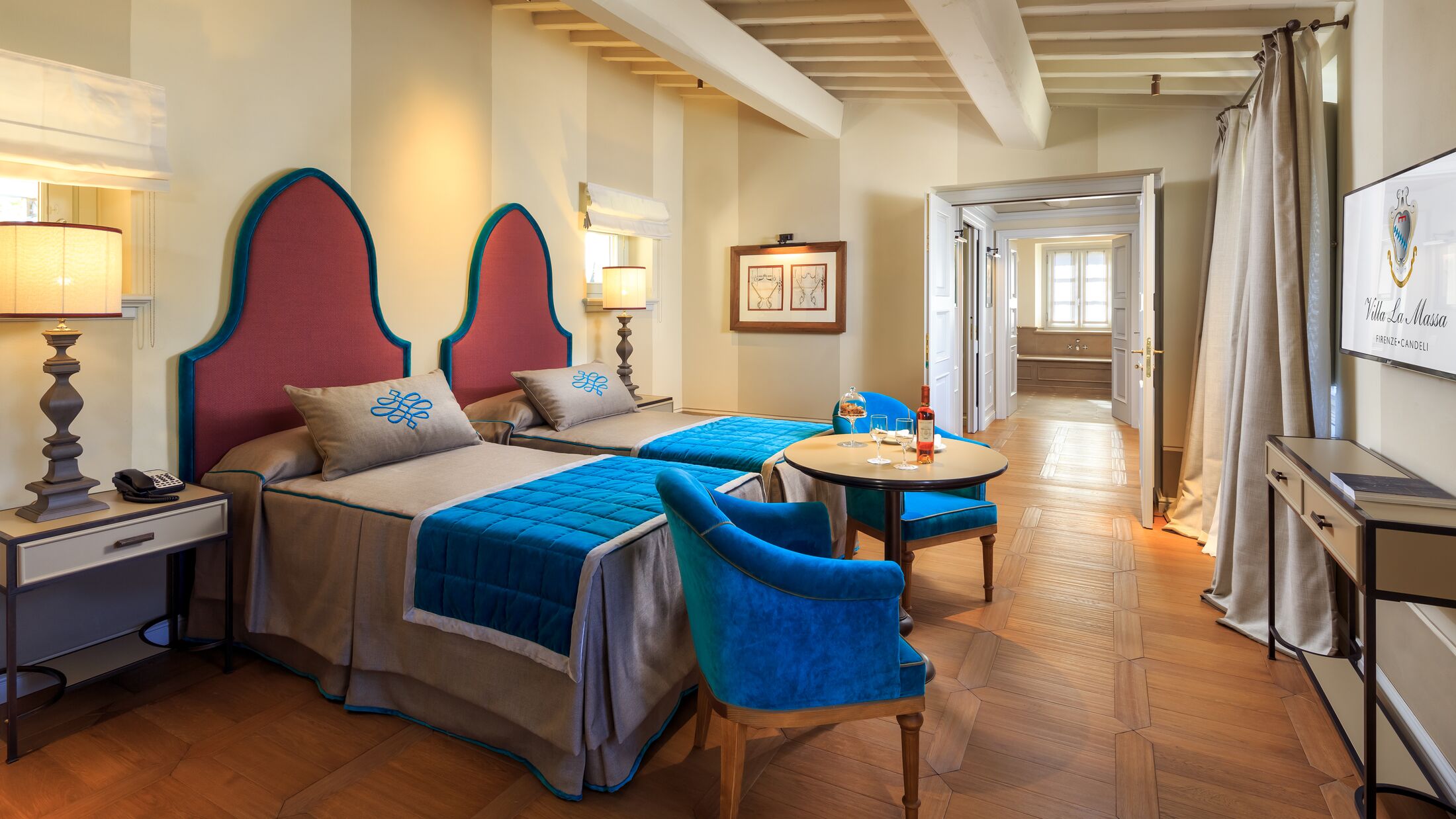 a bedroom with a bed and a chair in a room