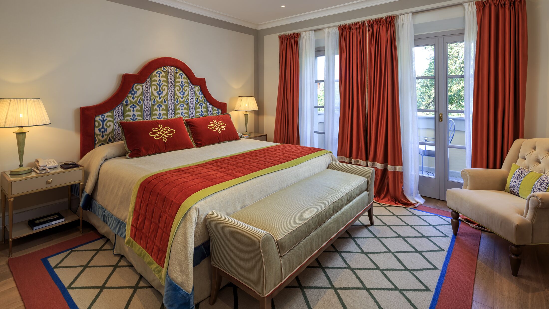 a bedroom with a large bed in a hotel room