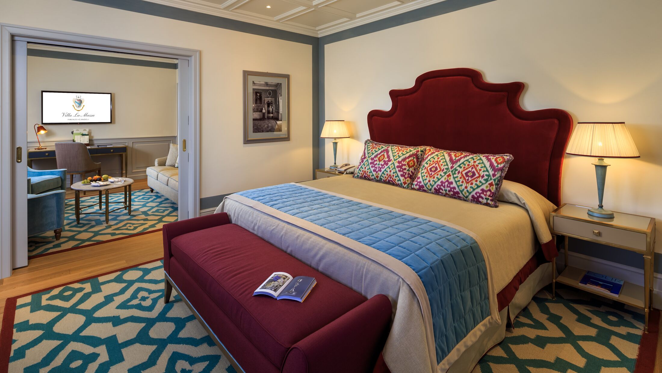 a bedroom with a bed and a chair in a room
