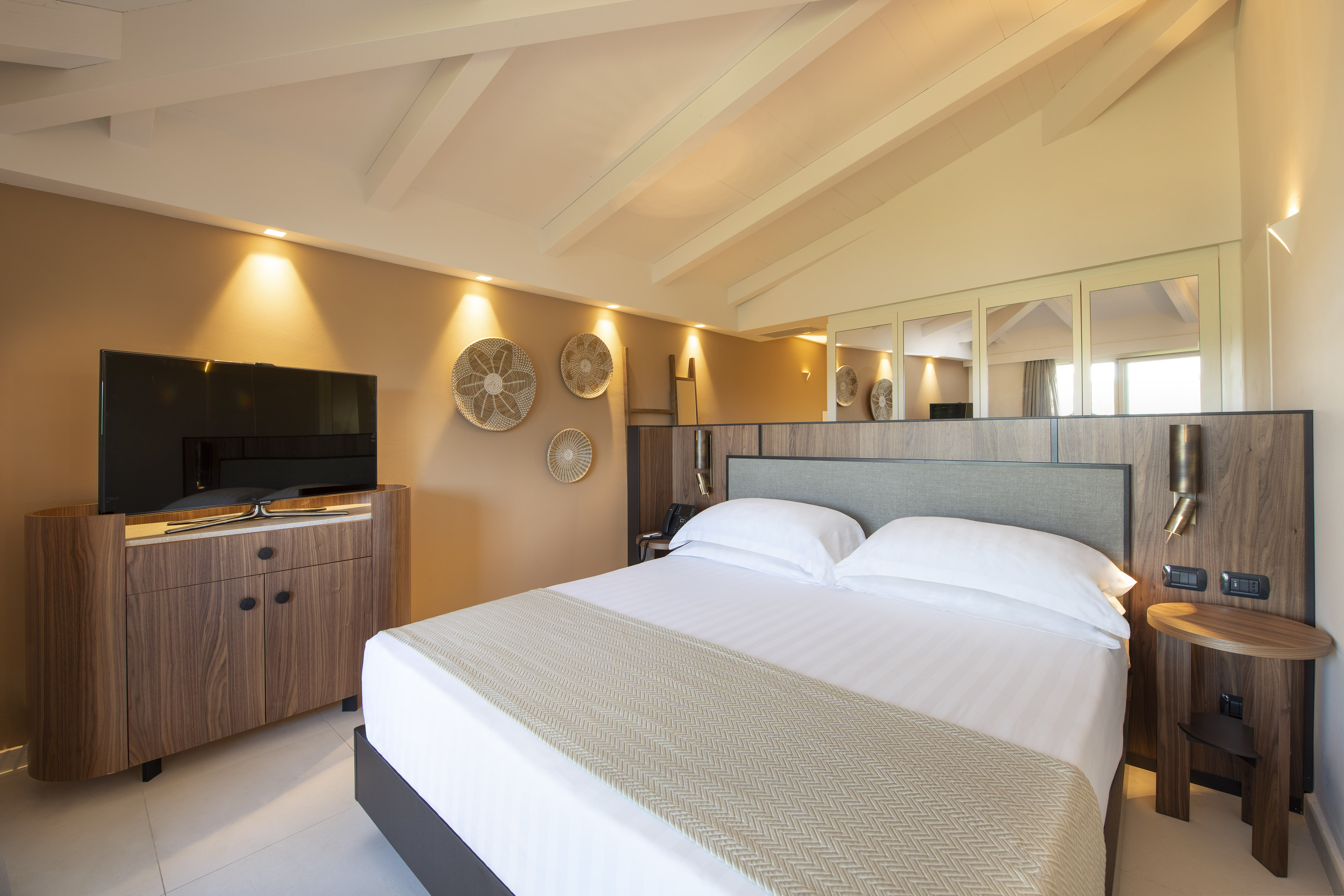 a bedroom with a large bed in a hotel room