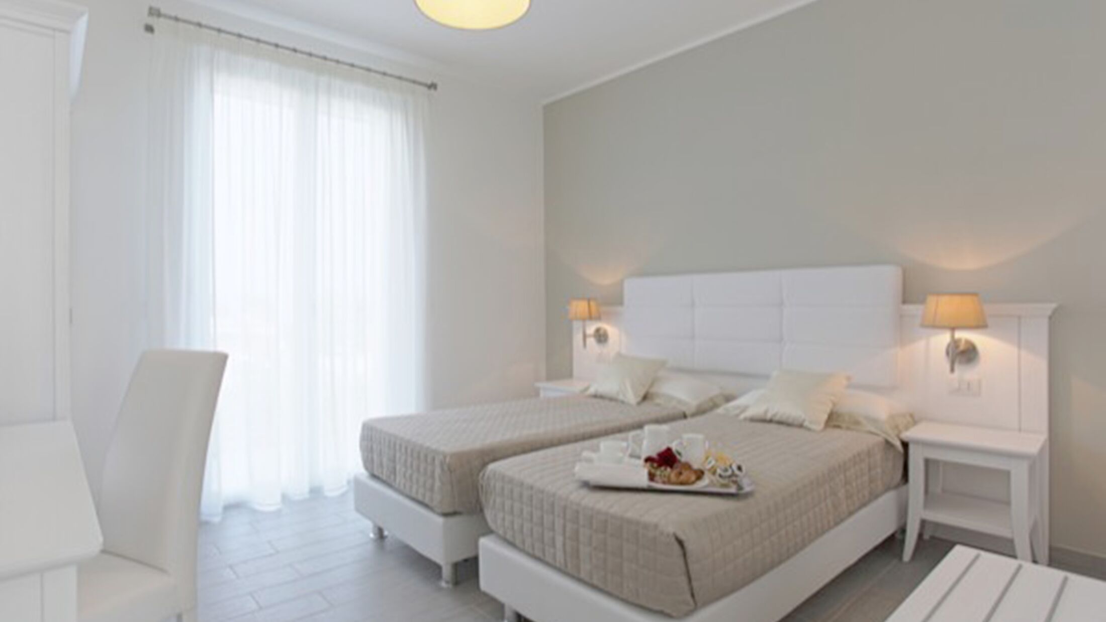 a bedroom with a bed and a mirror