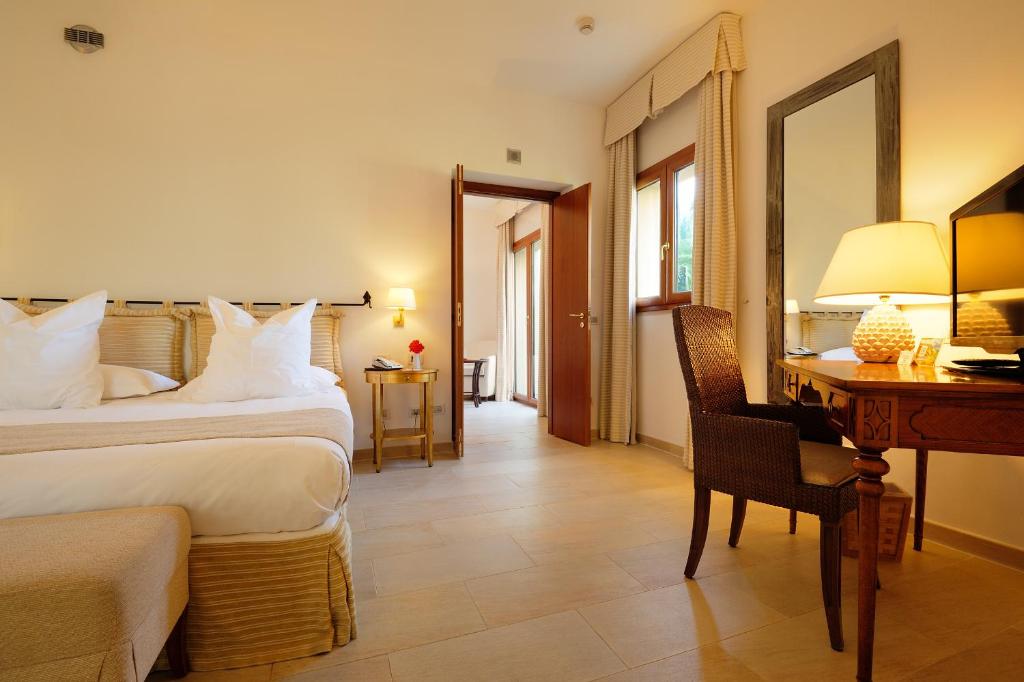 a bedroom with a large bed in a hotel room