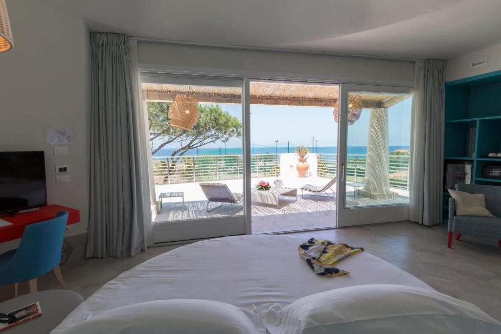 a living room with a bed and a large window