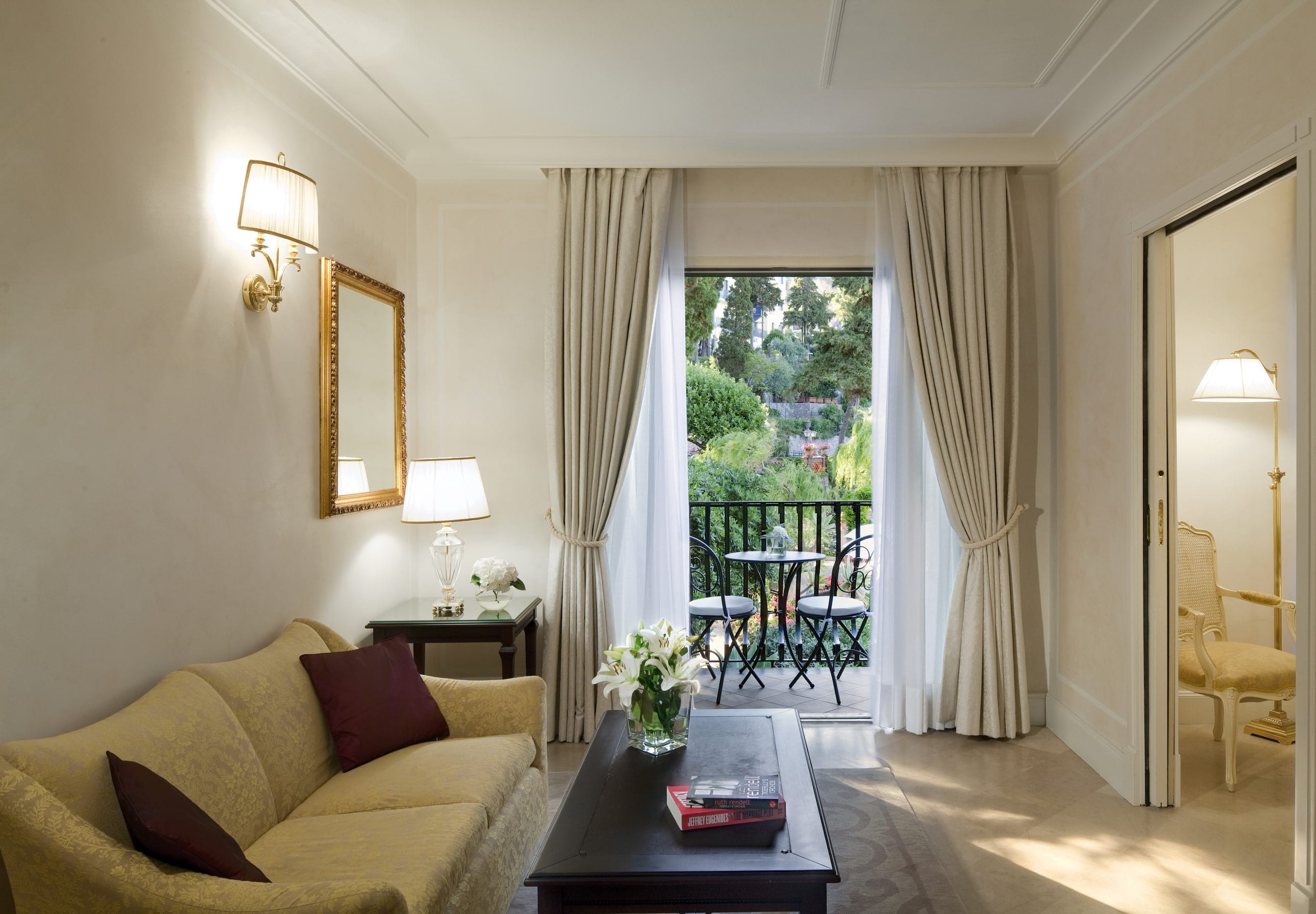 a living room filled with furniture and a large window