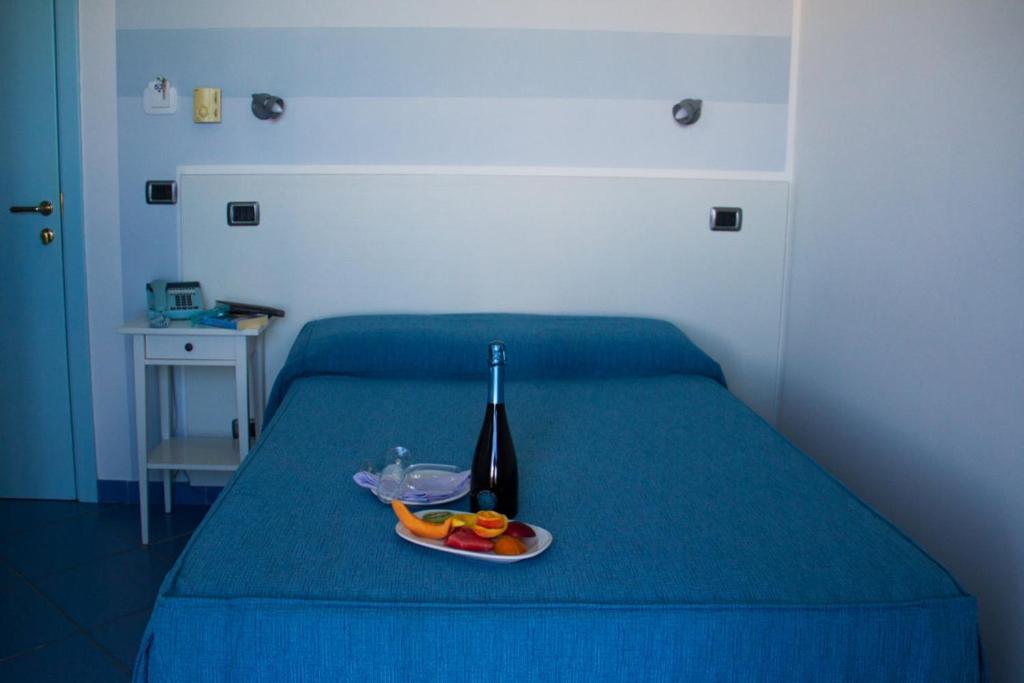 a bedroom with a blue background