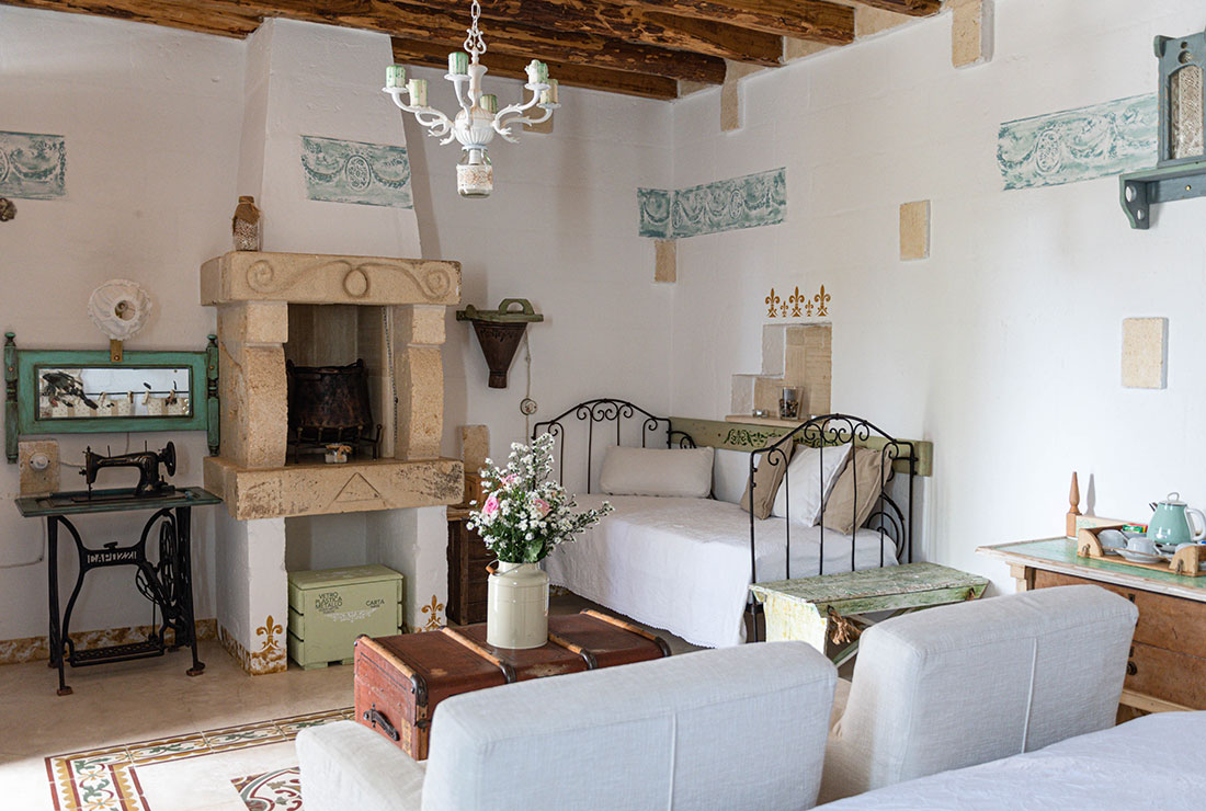 a living room filled with furniture and vase on a table