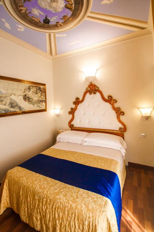 a bedroom with a bed and a mirror