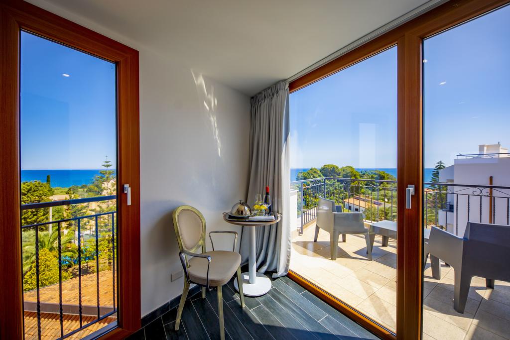 a view of a living room filled with furniture and a large window