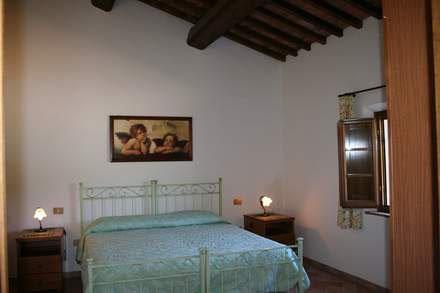 a bedroom with a bed in a room