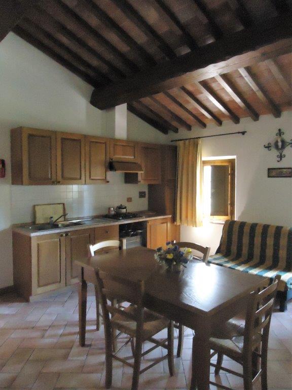 a kitchen with a dining room table