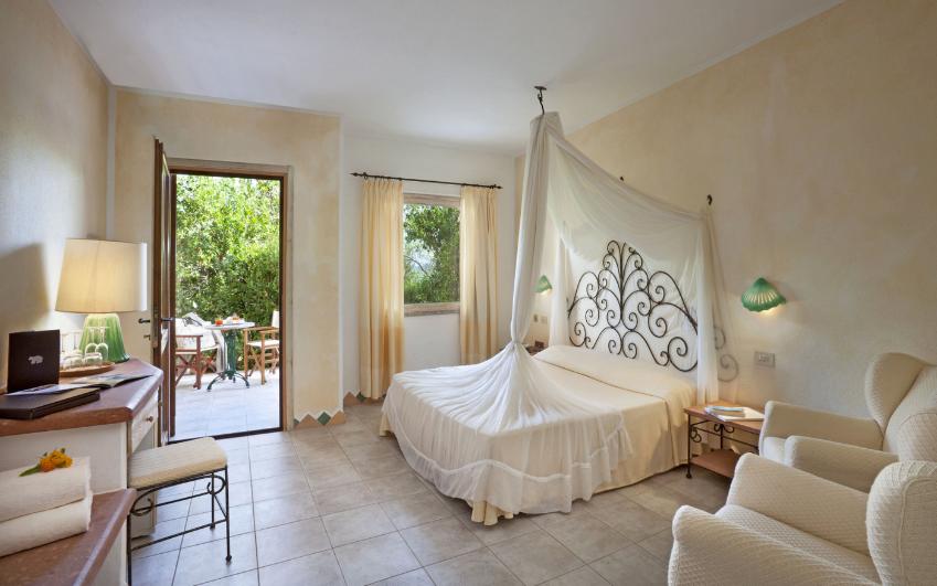 a living room filled with furniture and a large window