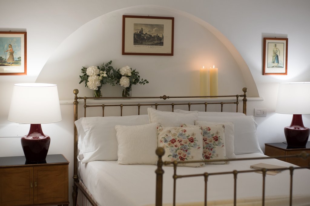 a bedroom with a view of a living room