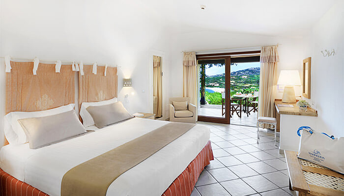 a bedroom with a large bed in a hotel room