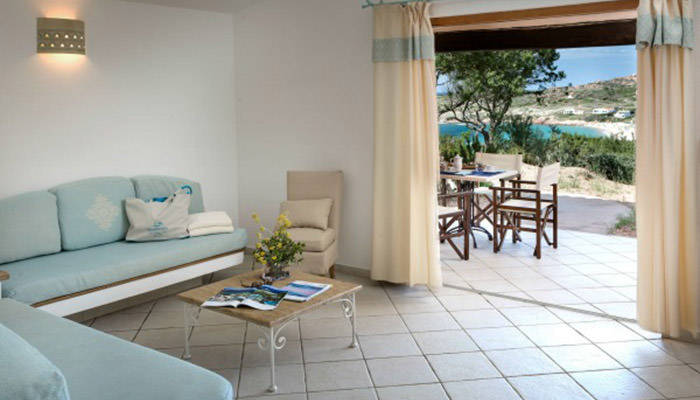 a living room filled with furniture and a large window