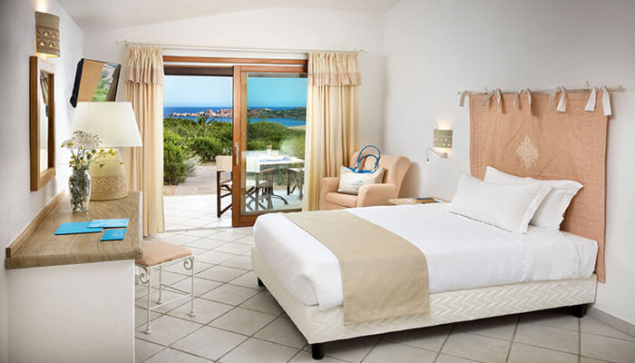 a bedroom with a large bed in a room