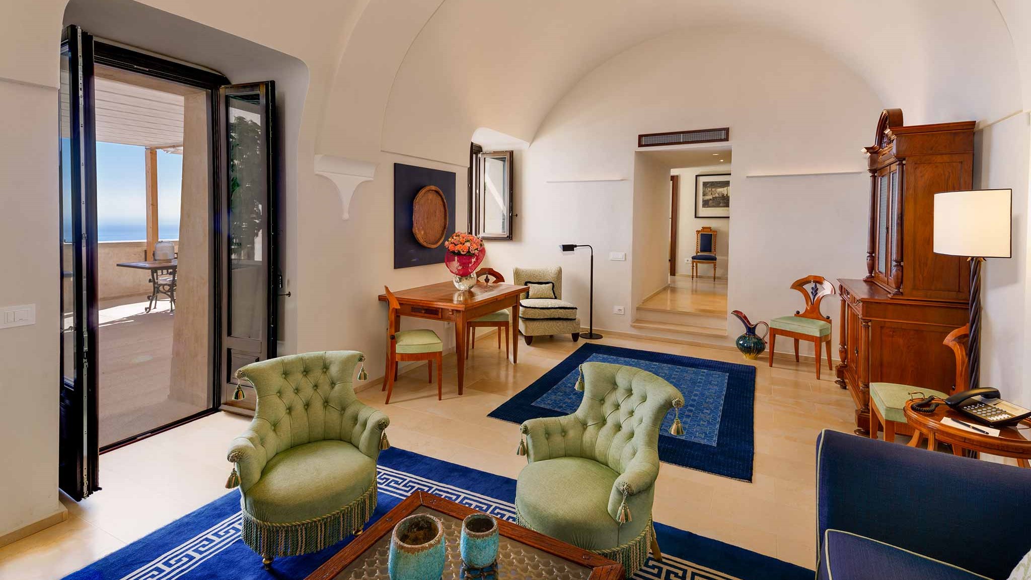 a living room filled with furniture and a fire place