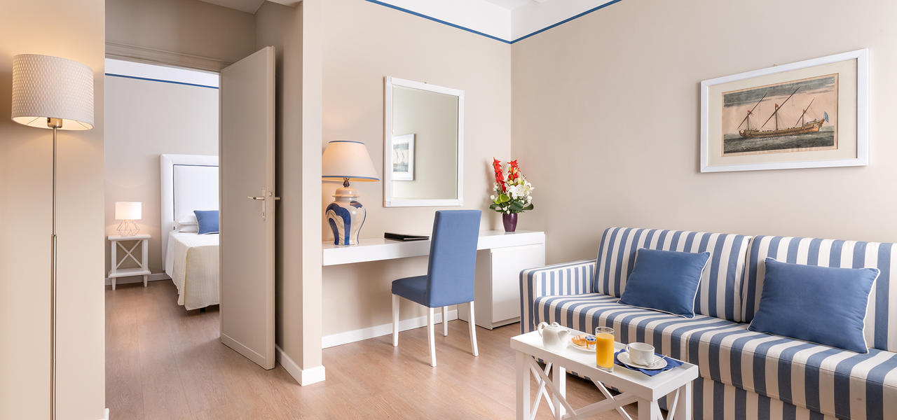 a living room filled with furniture and a tv