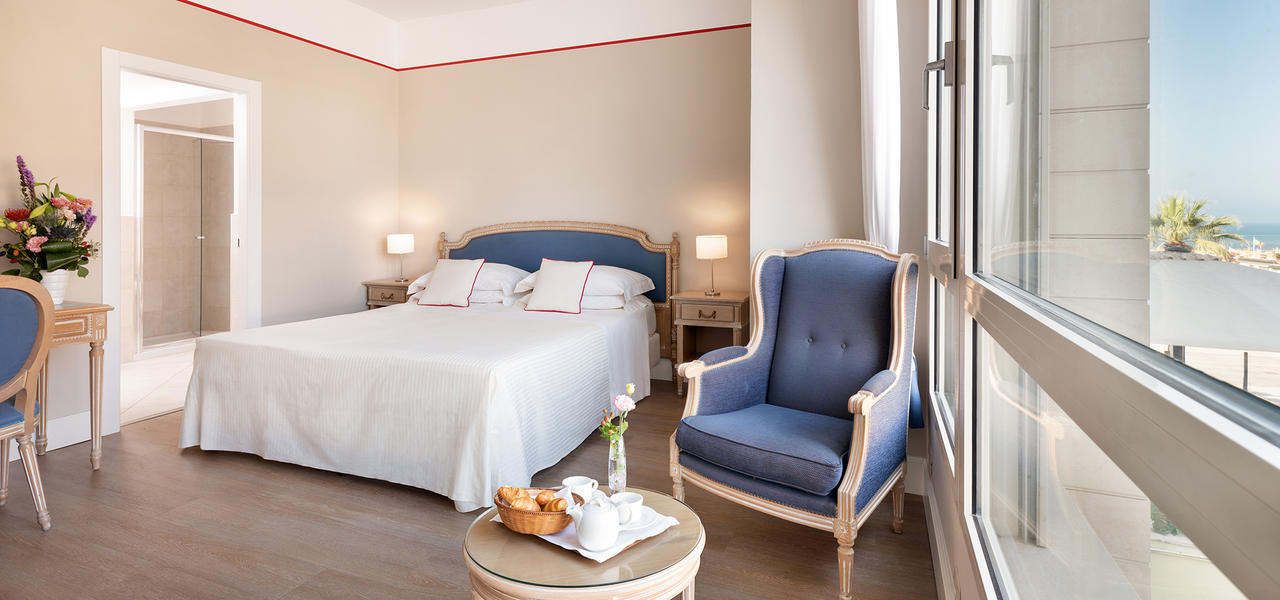 a bedroom with a bed in a room