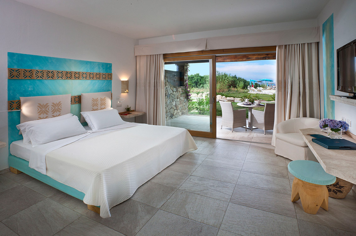 a bedroom with a large bed in a room