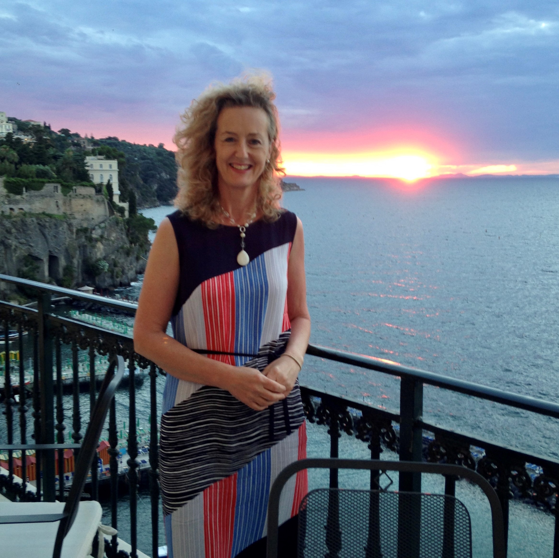 a person standing on a bridge over a body of water