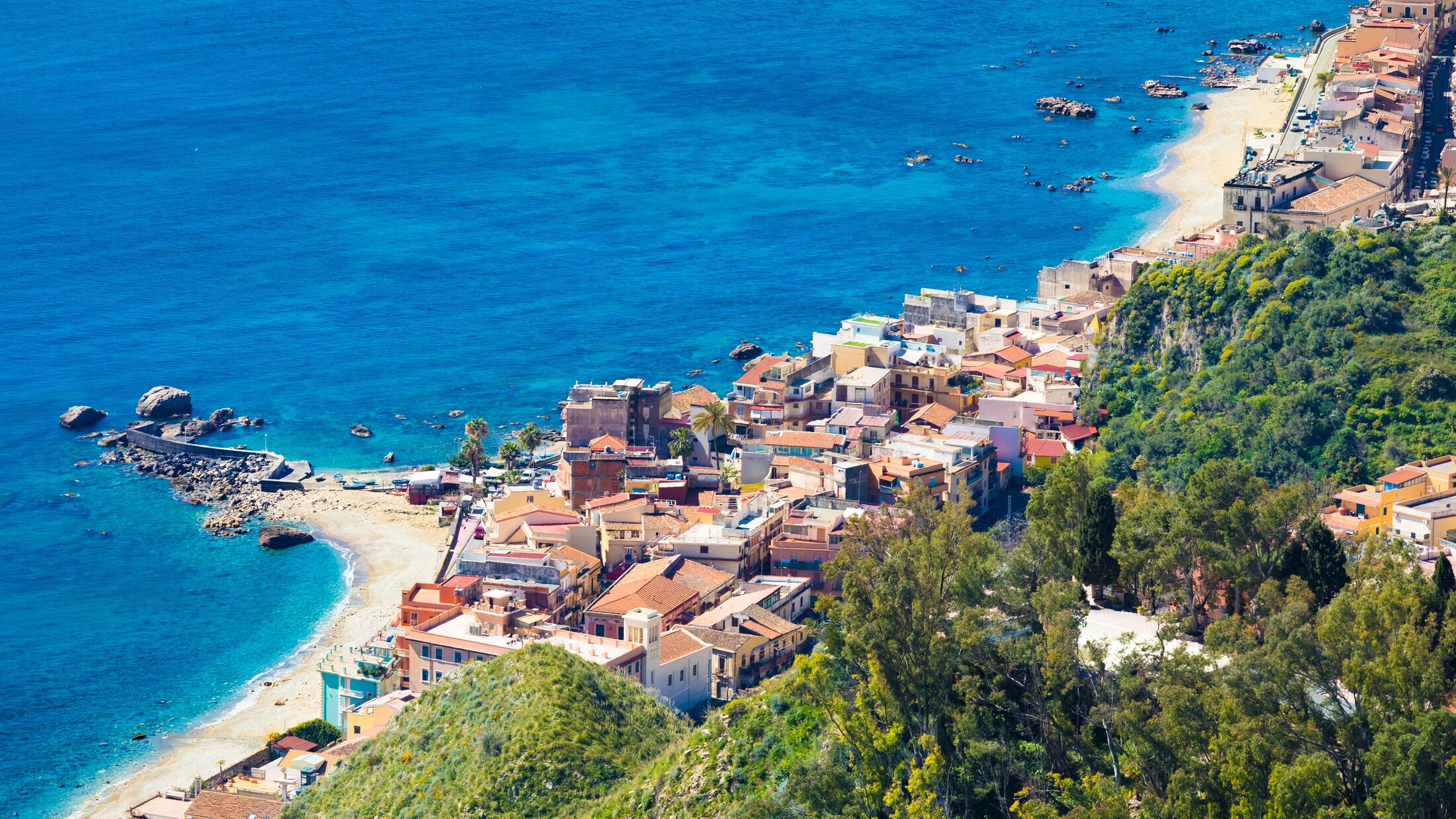 Aerial view of Giardini Naxos, comune in Messina on Sicily Island, Italy. It is situated on coast of Ionian Sea between Cape Taormina and Cape Schiso.