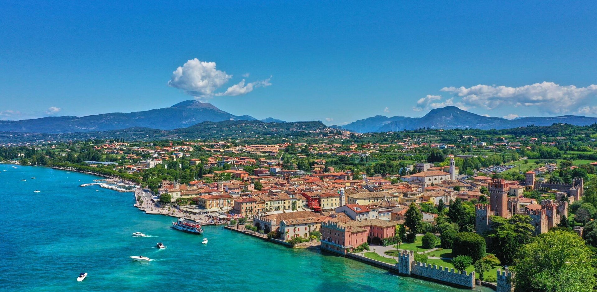 Panoramic view of the resort town of Lazise on Lake Garda, north of Italy. Aerial photography with drone.