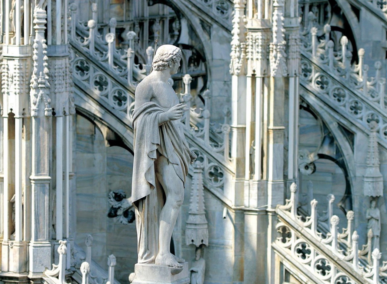 a statue in front of a building