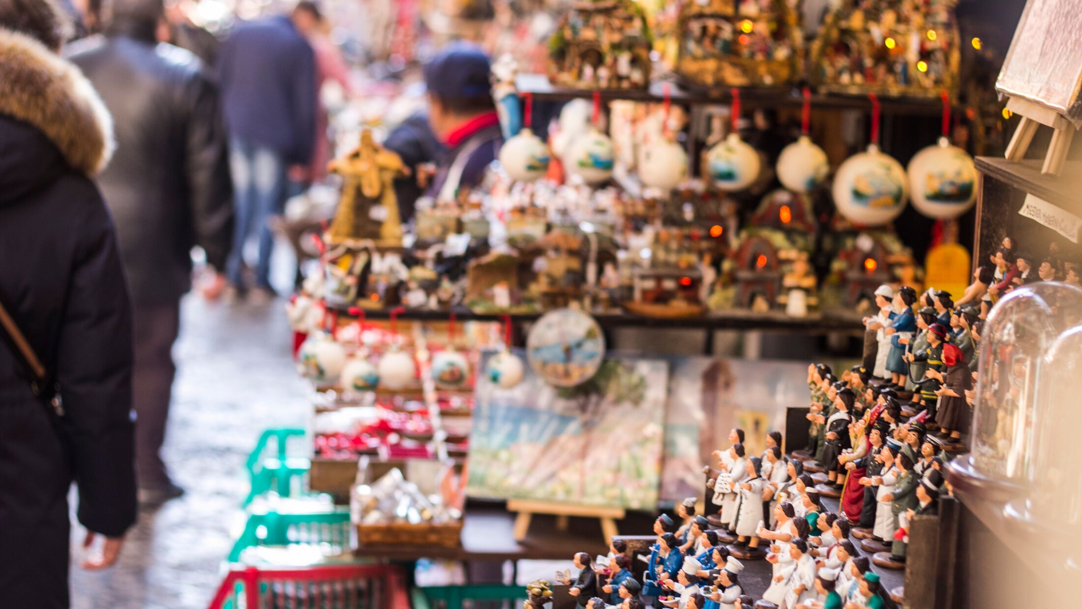 Souvenirs store with humans figures in Naples, Italy