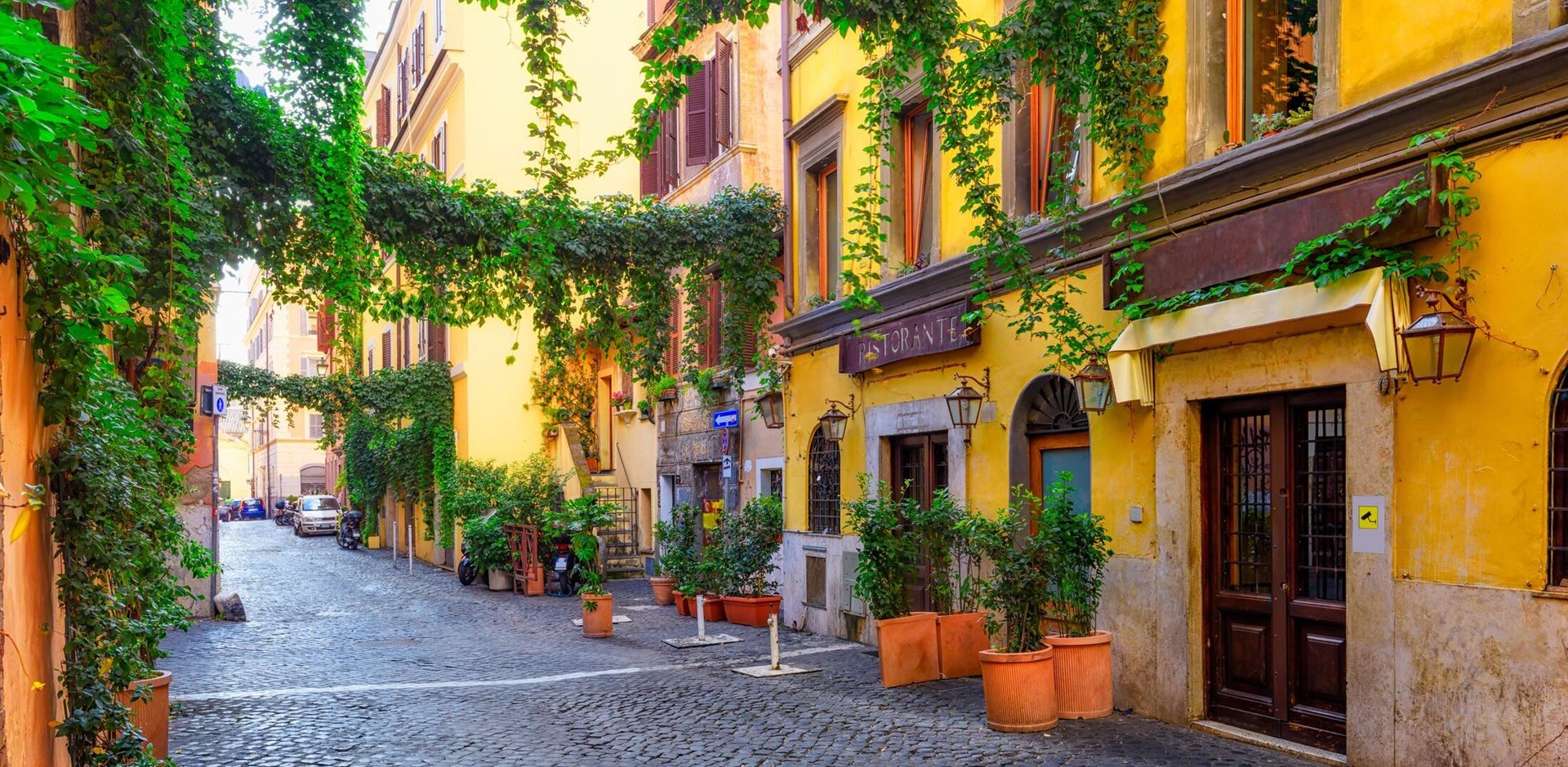 Cozy old street in Trastevere in Rome, Italy. Trastevere is rione of Rome, on the west bank of the Tiber in Rome, Lazio, Italy.  Architecture and landmark of Rome