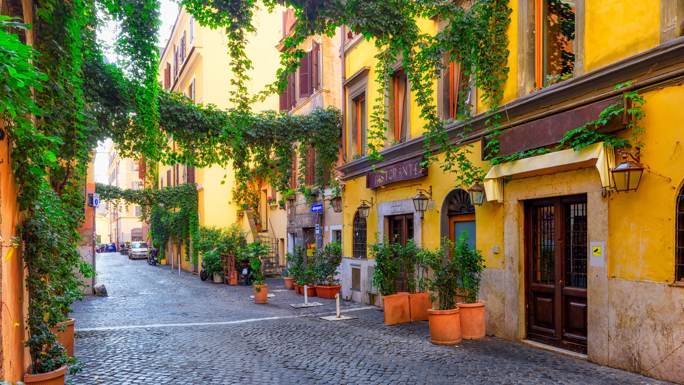 Cozy old street in Trastevere in Rome, Italy. Trastevere is rione of Rome, on the west bank of the Tiber in Rome, Lazio, Italy.  Architecture and landmark of Rome